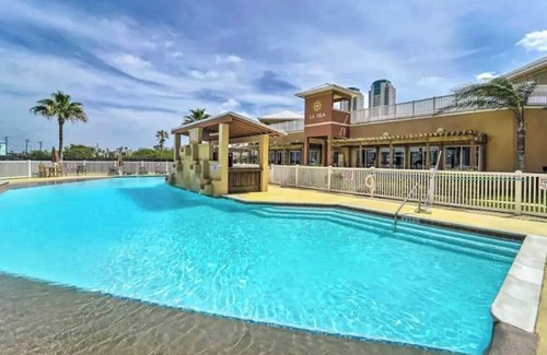 South Padre Island Condo | Coral Cave Luxury Condo! Enjoy the beach, pools, BBQs, and bay views.