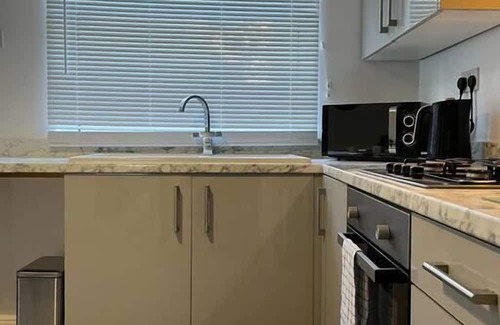 Margam Apartment | Morriston Accommodation - TV in Every Bedroom!