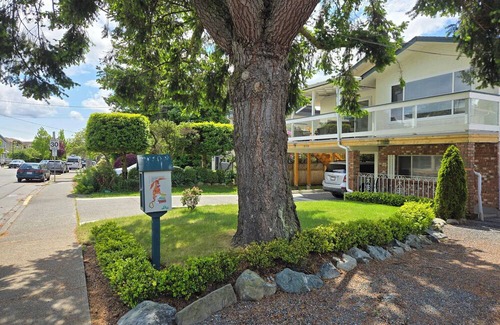 Booktown Apartment | Fully furnished garden suite one block from downtown, ocean in charming Sidney