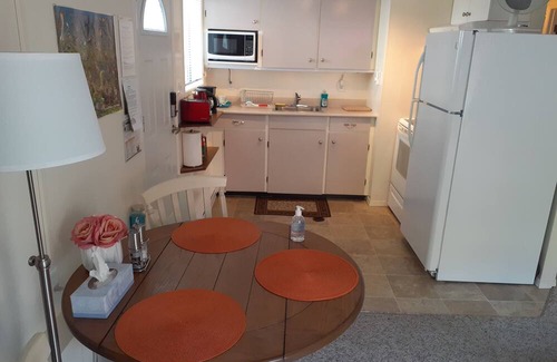 Booktown Apartment | Fully furnished garden suite one block from downtown, ocean in charming Sidney