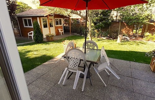Booktown Apartment | Fully furnished garden suite one block from downtown, ocean in charming Sidney