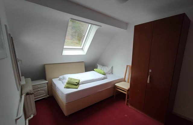 Single room with shared bathroom and kitchen