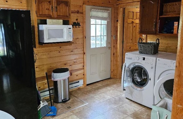 1 bedroom/1 bath cabin house with garage! Large front & back deck w/big backyard