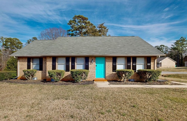 Perfectly located home with deck, open layout, smart TVs, central AC, & W/D