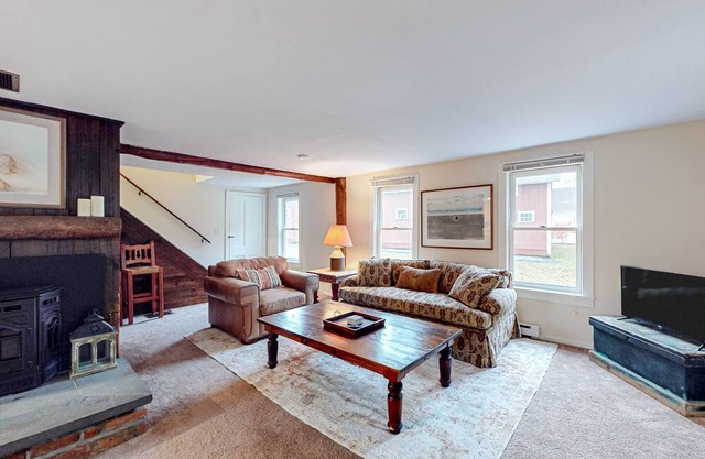 1900 farm property with old-world ambiance, updated kitchen, & mountain views