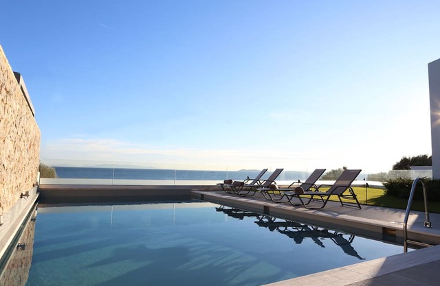 Beach front villa with private sea water pool & amazing sea view to Saronic golf
