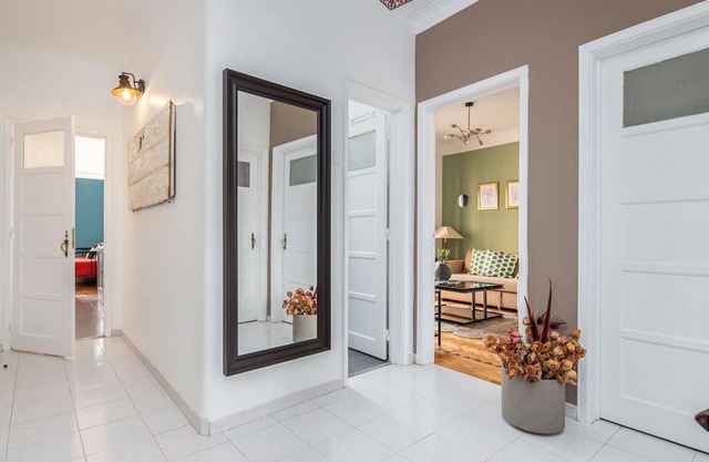 Classy 4BDR Apartment W/ Balcony by LovelyStay