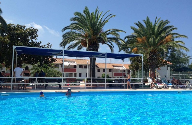 Holiday Apartment "Trilocale 30 Residence La Giungla" with Sea View, Shared Pool & Wi-Fi