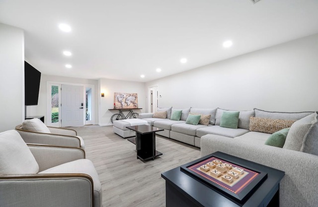 Features two living rooms, sauna, hot tub, and fire pit -over 4 acres of land.