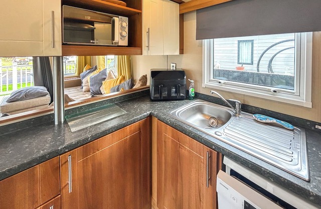 Spacious caravan sleeps six, with private decking and master ensuite.