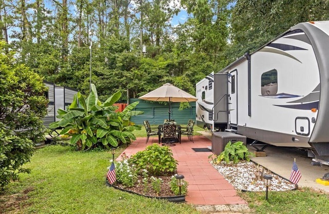 Spacious luxury RV with large kitchen/living room area, private bedroom w/king-size bed, bath and 1/2, with a deck, located in a beautiful RV resort with tons of amenities. Min. stay is 2 nights w/weekly and monthly discounts. Monthly rate is $1,600