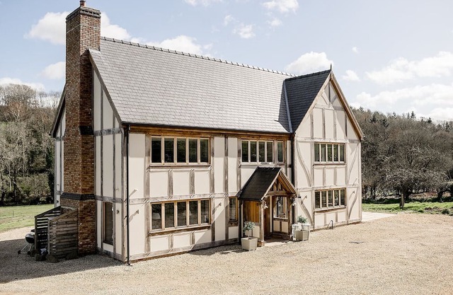 A luxurious riverside cottage with stunning views, a hot tub, and fishing access.