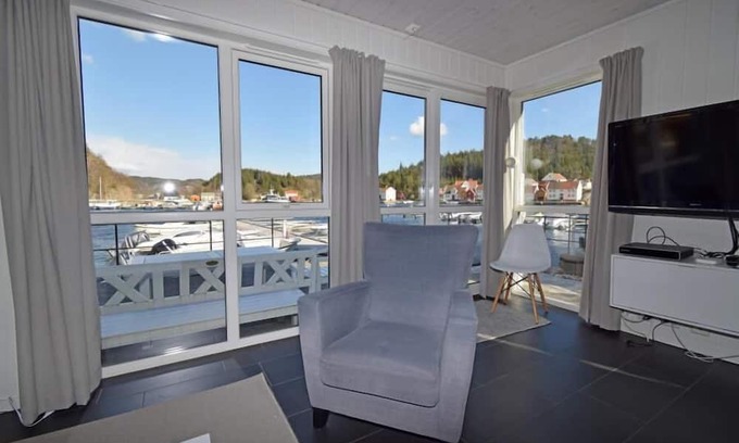 Lindesnes House | Holiday home 'Furuholmen Brygge 7', Furuholmen peninsula near Lindesnes, southern Norway, up to 7 people possible, e.g. 4 adults and 3-4 kids, 4 bedrooms, 2 shower-bathrooms, modern equipment, terrace and boat mooring in front of the house on the .
