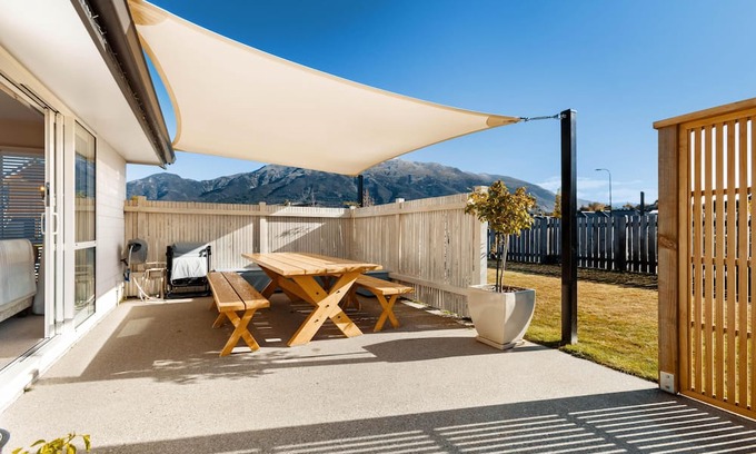 Lake Hawea House | Home nestled in Hawea - A four-bedroom Hawea home with mountain views. Enjoy a modern kitchen, spacious living areas, two bathrooms, and a cosy fireplace