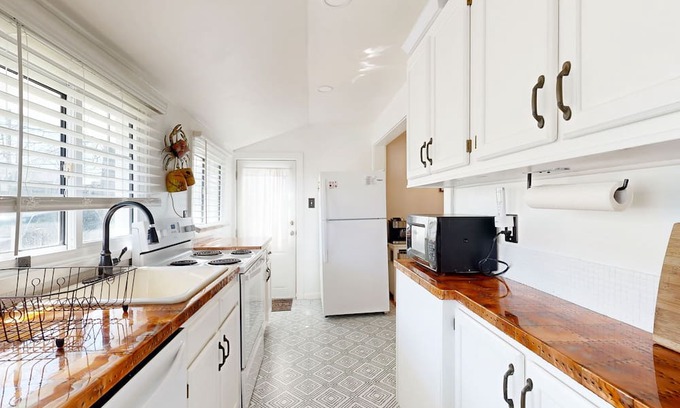 North Beach House | Charmingly restored, dog-friendly retreat with great deck & walkable location