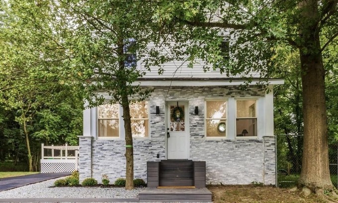 Mickleton House | Embrace the charm of our creekside haven featuring 4BR 3BA yoga and BBQ deck.