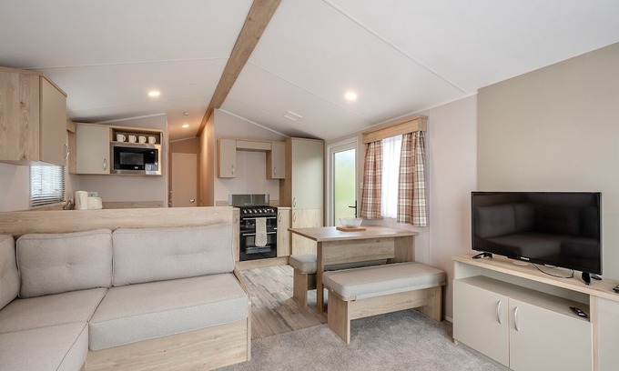 Sandyhills House | This spacious 2 bedroom caravan sleeps 4 people in one double and one twin bedroom.
