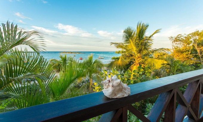Island Harbour House | Exquisite 3 Bedroom villa. Unwind with beach views, and gentle island breezes.