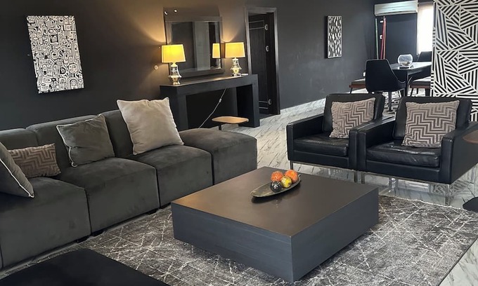 Ofin Apartment | Chic and Spacious: Modern 4-Bedroom Flat with a Sleek Black Twist