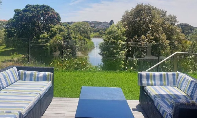 Gulf Harbour House | Down the steps. Two Bedrooms Lake views.