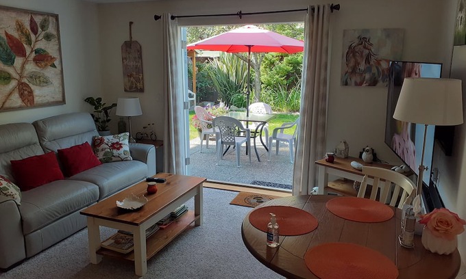 Booktown Apartment | Fully furnished garden suite one block from downtown, ocean in charming Sidney
