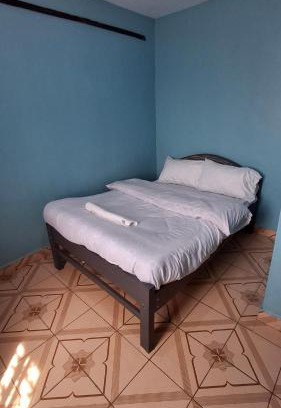 Ngelani House | Purple building